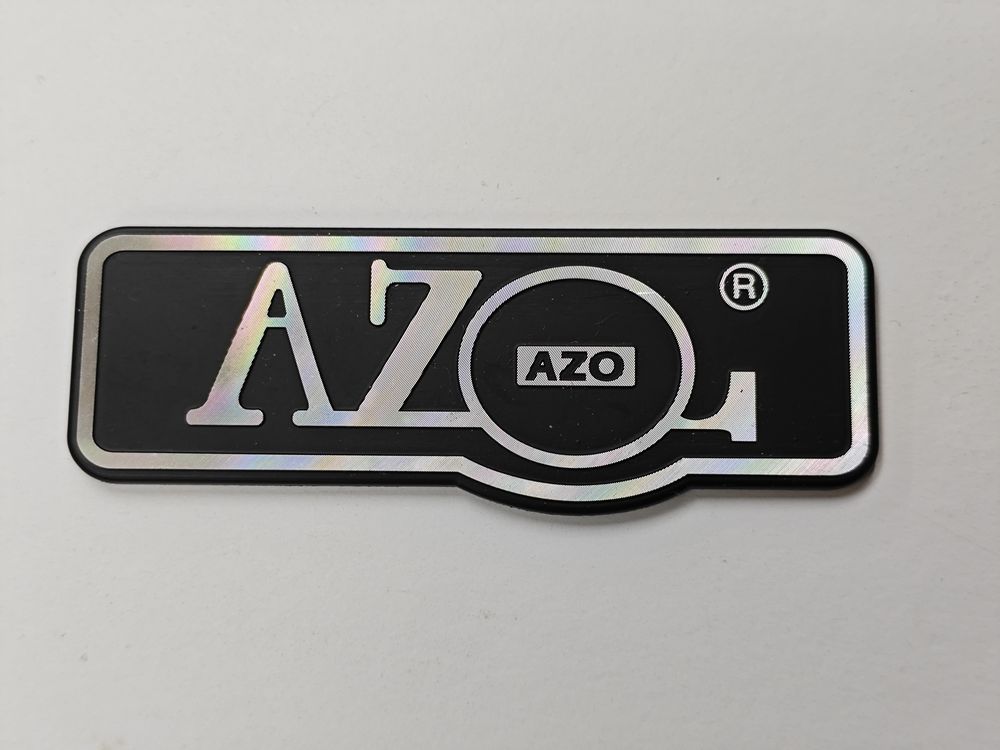 Die-cast aluminum nameplate